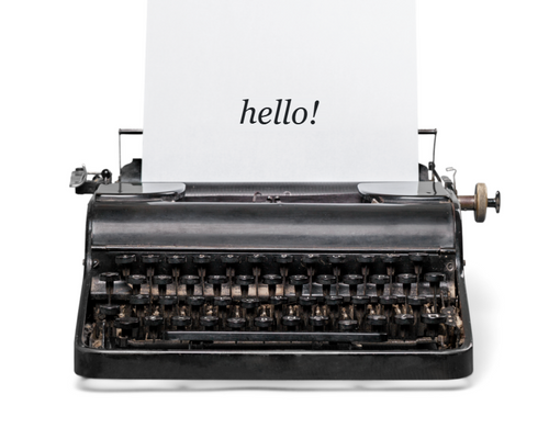 Vintage typewriter with a page that says hello!